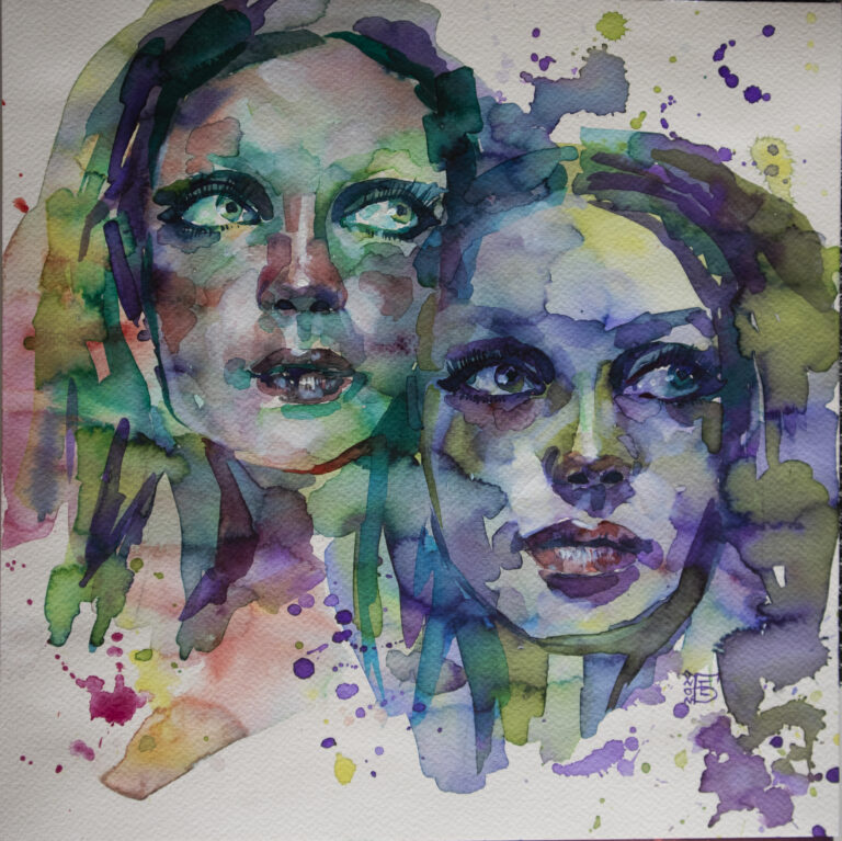Two feminine faces, mirroring one another, form amidst splotches of vivid water color.