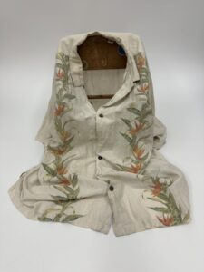 An embroidered gown that appears sitting on the ground.