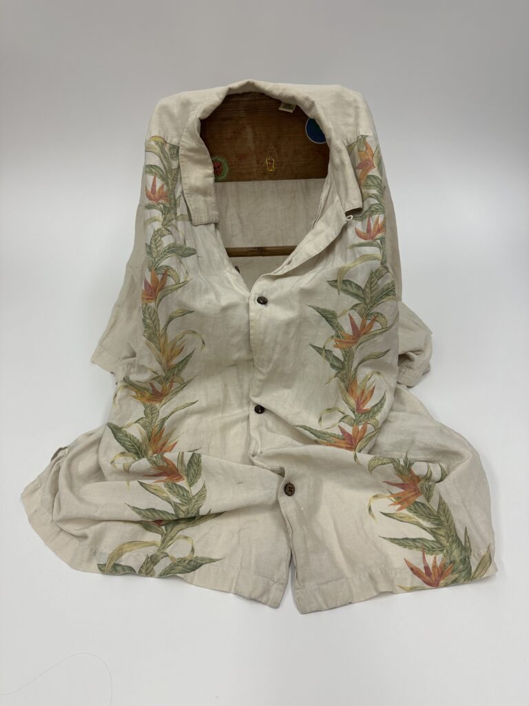 An embroidered gown that appears sitting on the ground.